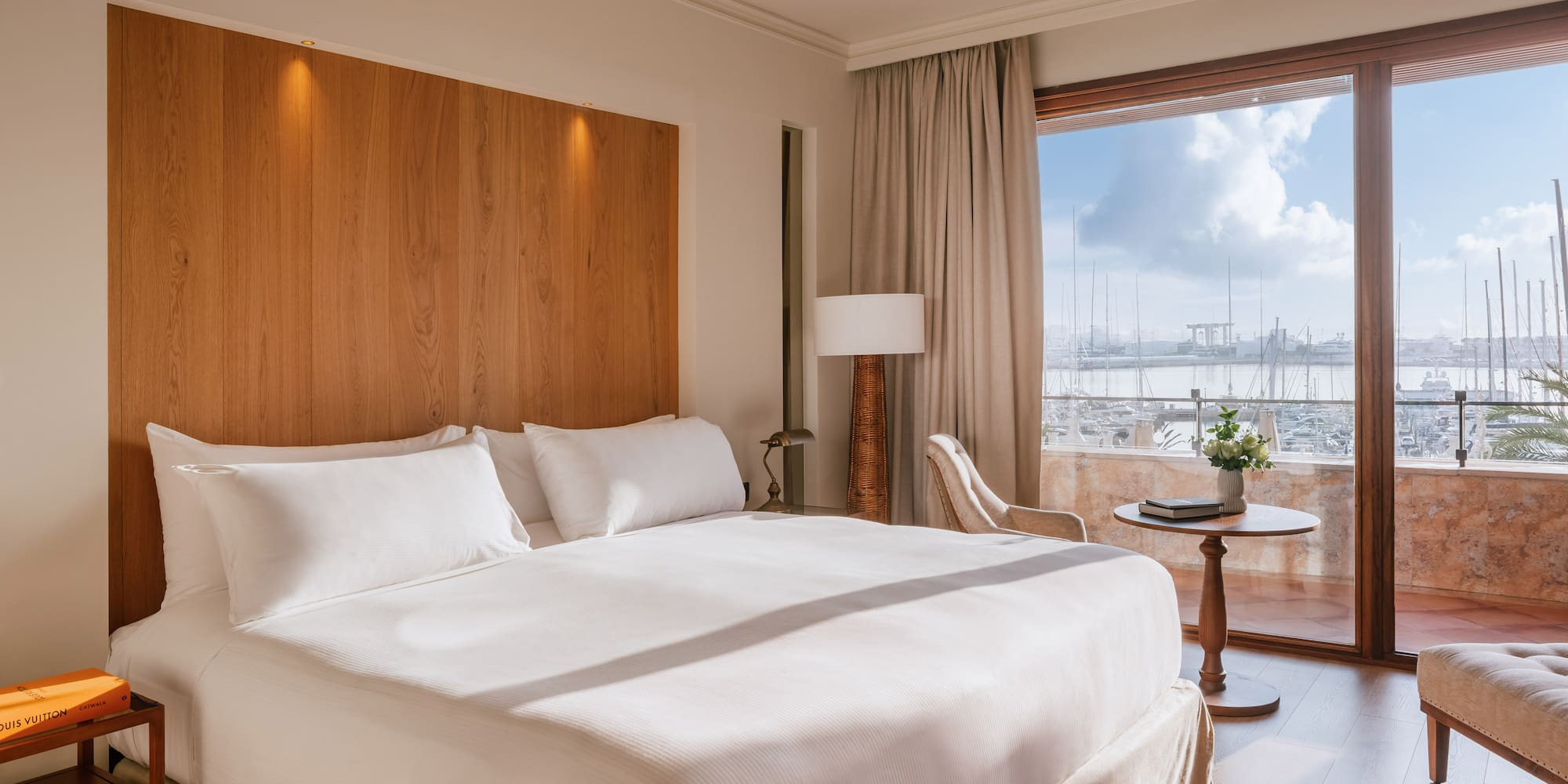 a bedroom with a large bed and a table