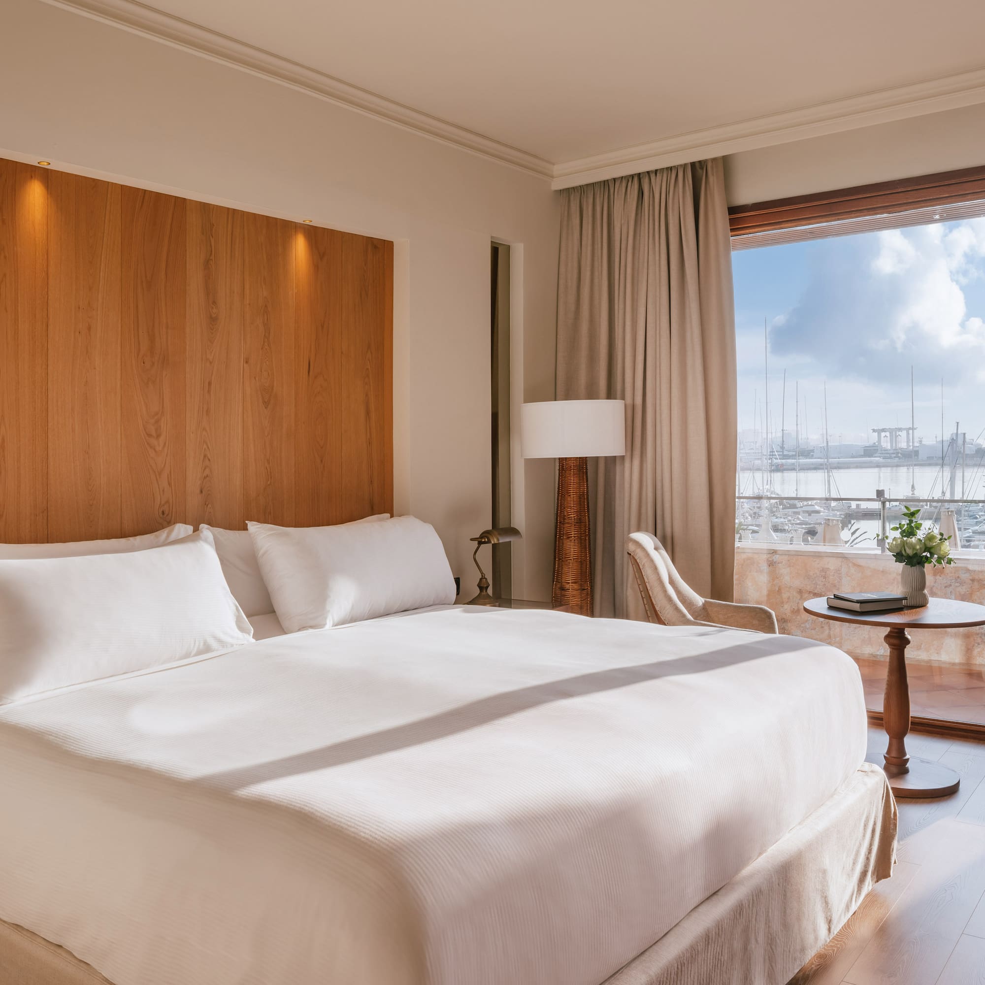 a bedroom with a large bed and a table