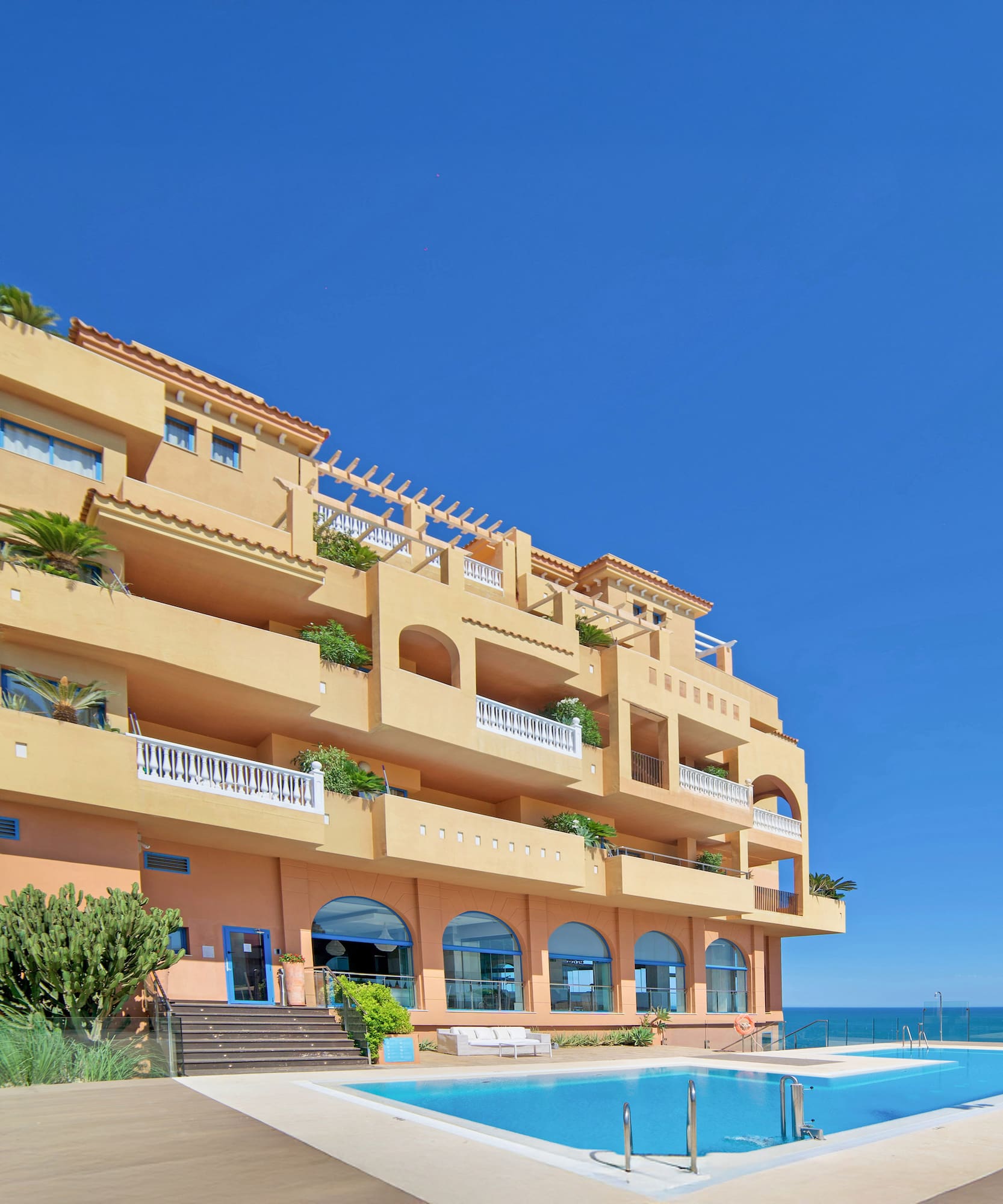 a building with a pool in front of it