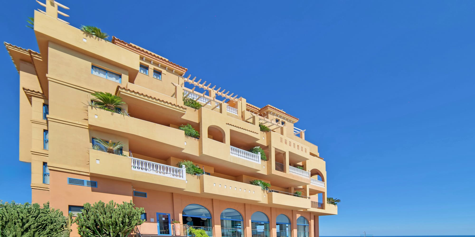 a building with a pool in front of it