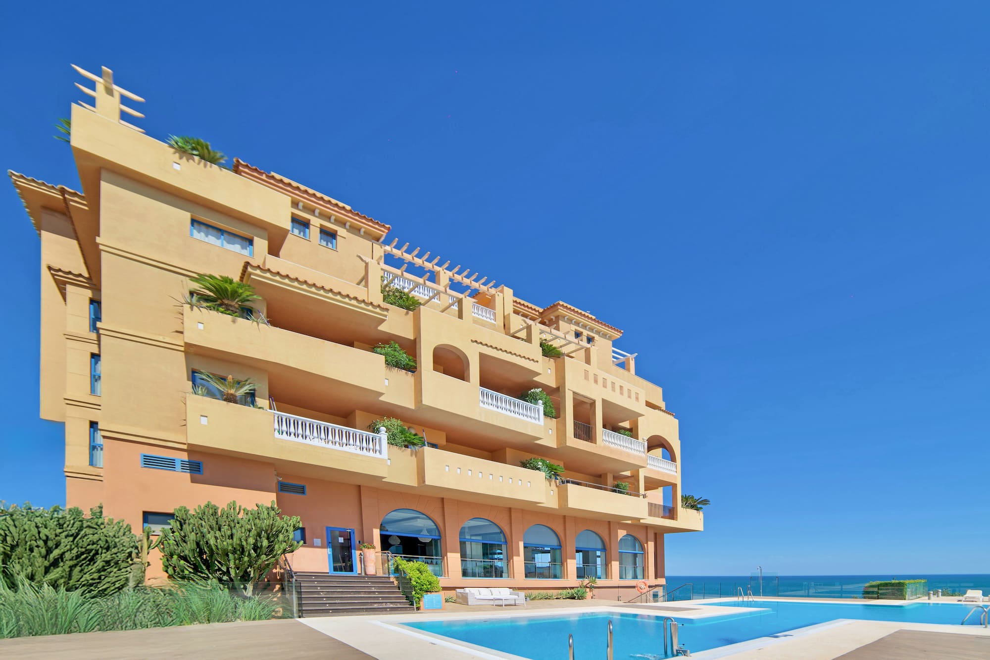a building with a pool in front of it