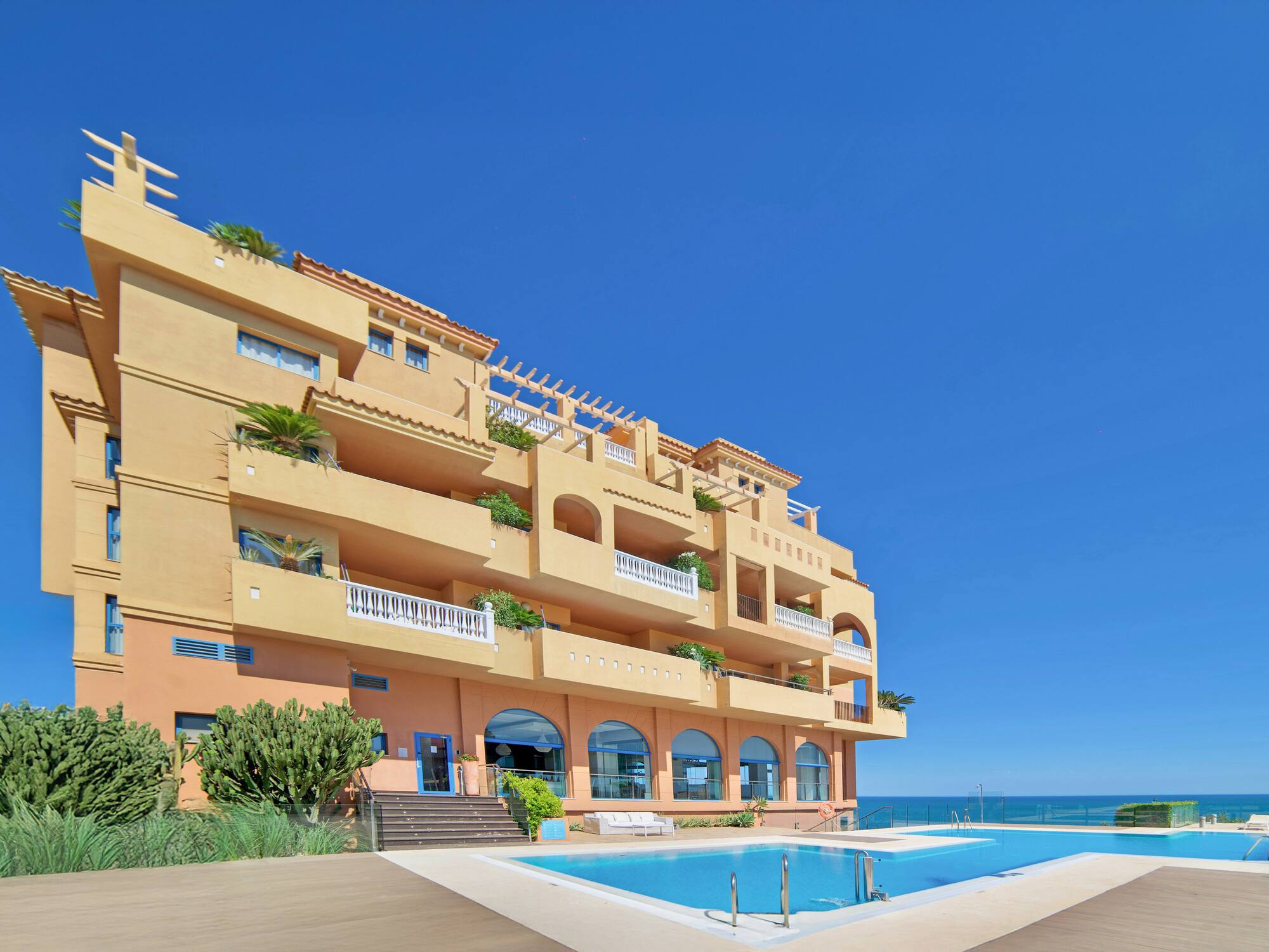 a building with a pool in front of it