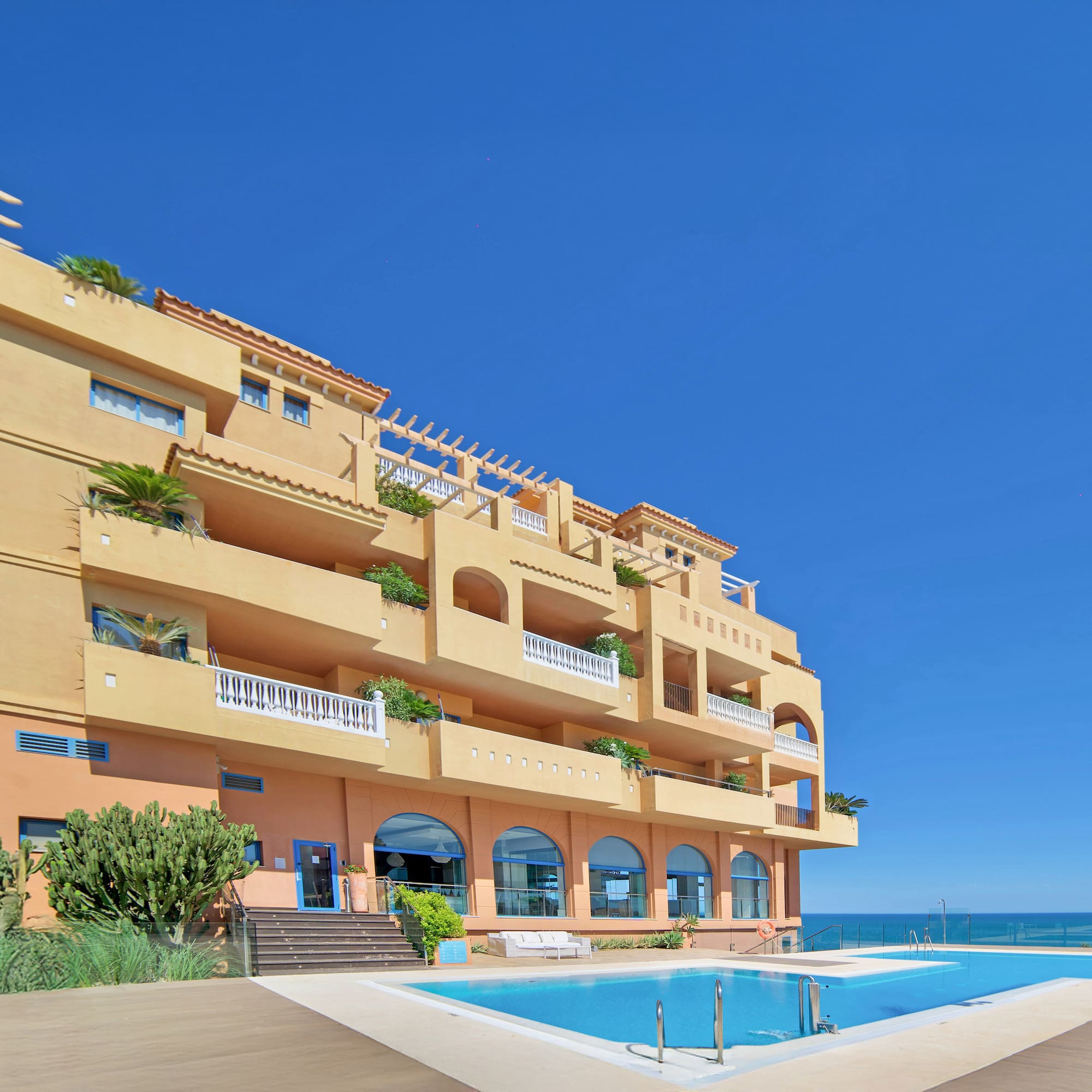 a building with a pool in front of it