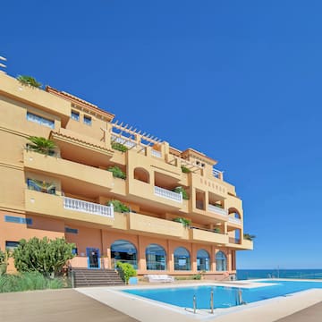 a building with a pool in front of it