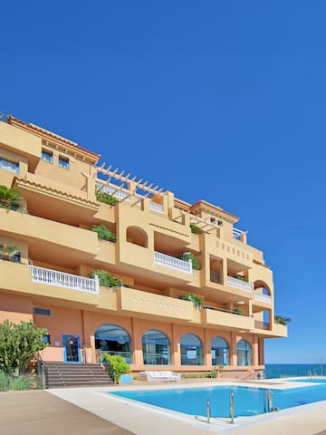 a building with a pool in front of it