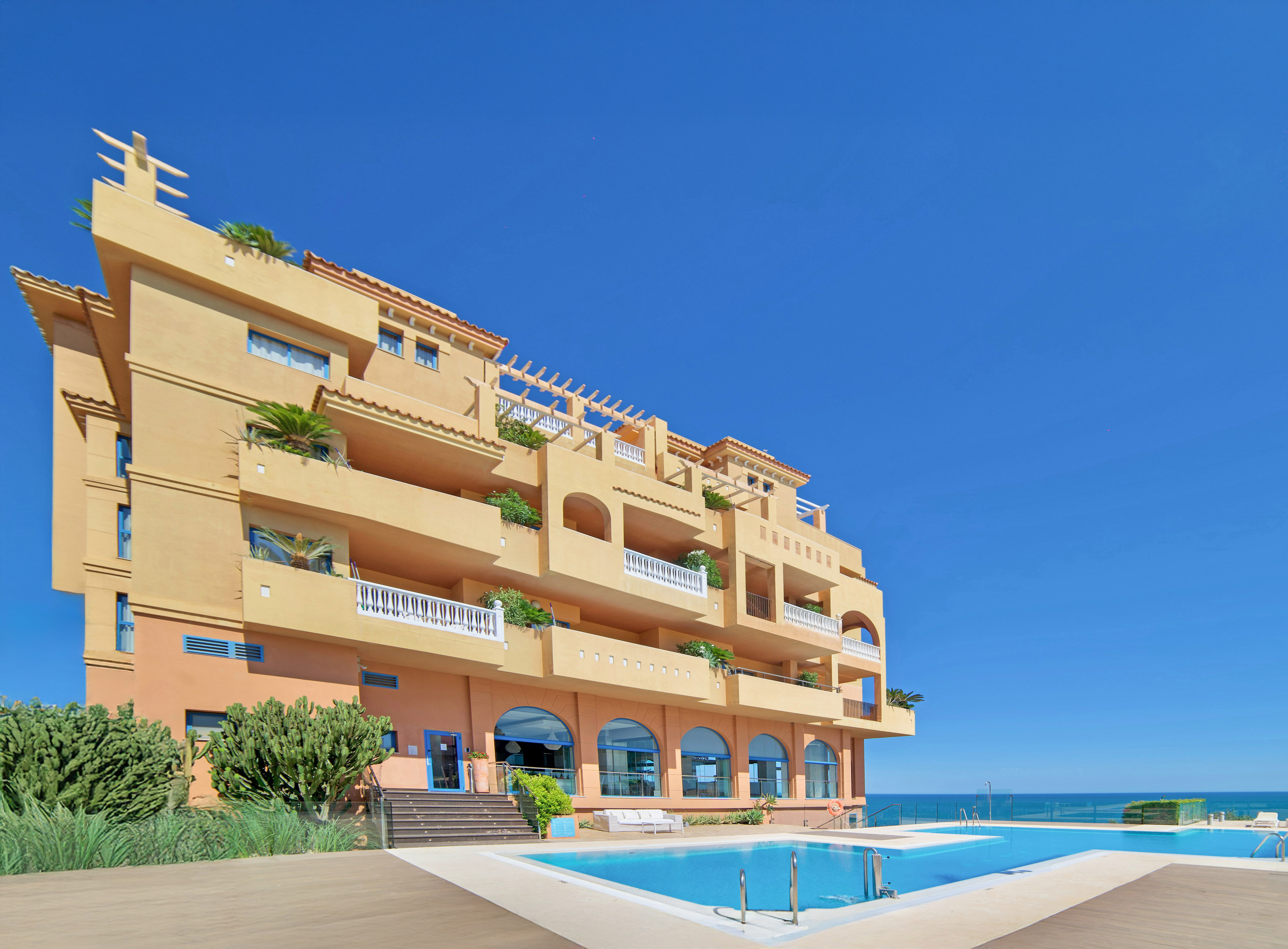 a building with a pool in front of it