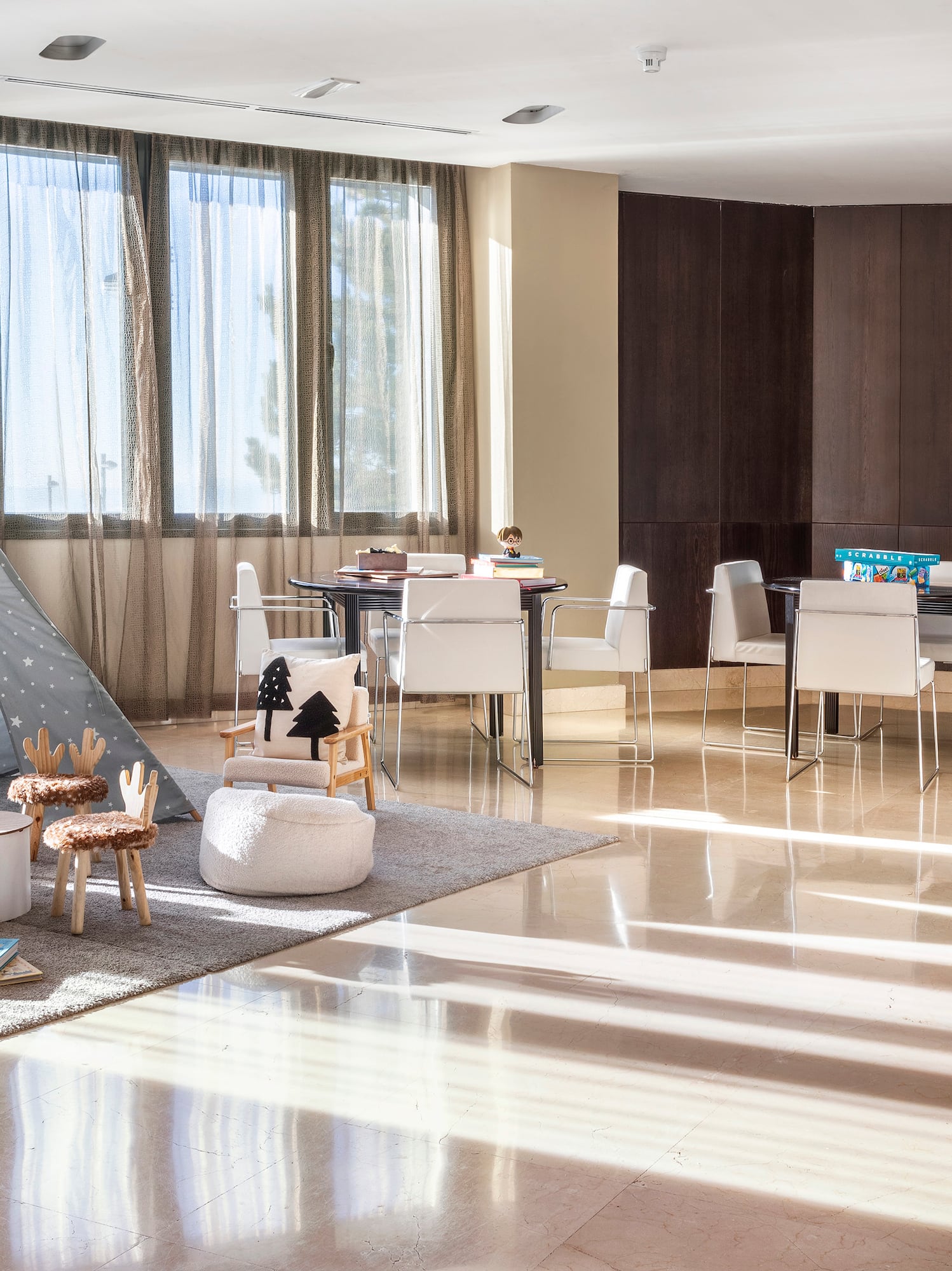 a room with a tent and chairs