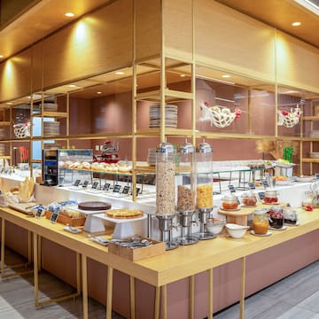a food buffet with a variety of food items on the counter