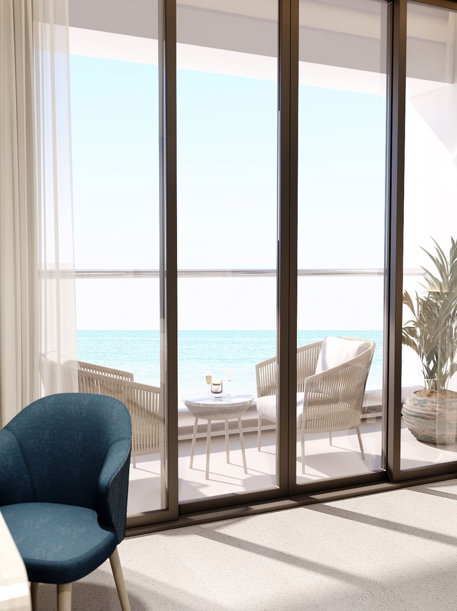 a room with a table and chairs and a table with chairs and a table with a view of the ocean