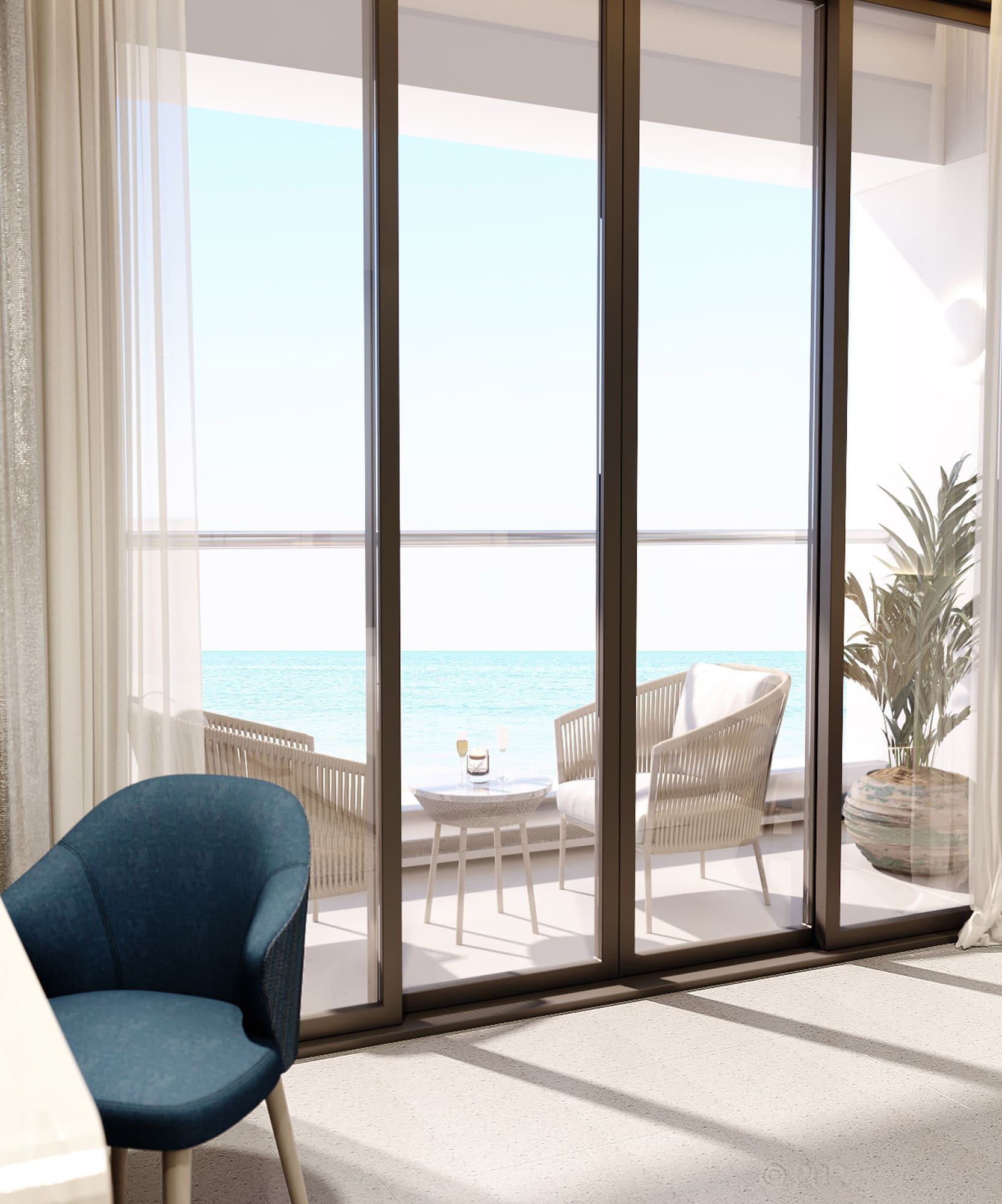 a room with a table and chairs and a table with chairs and a table with a view of the ocean