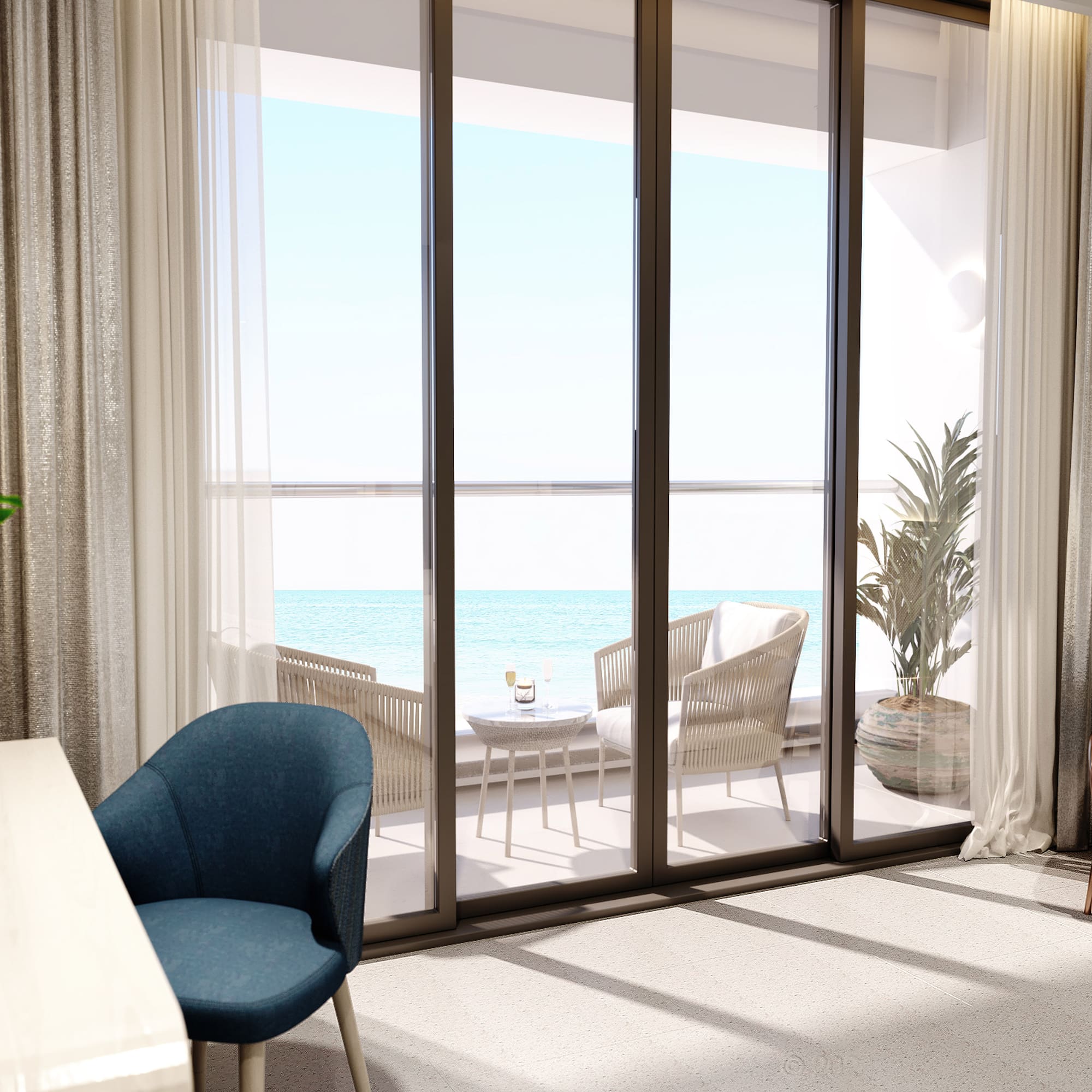 a room with a table and chairs and a table with chairs and a table with a view of the ocean