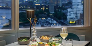 a table with food and wine glasses on it