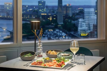 a table with food and wine glasses on it