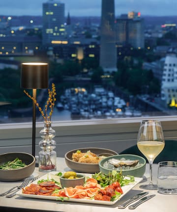 a table with food and wine glasses on it