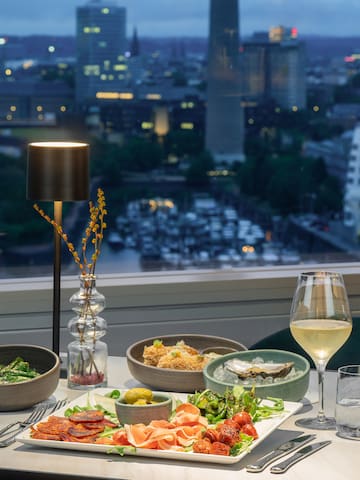 a table with food and wine glasses on it