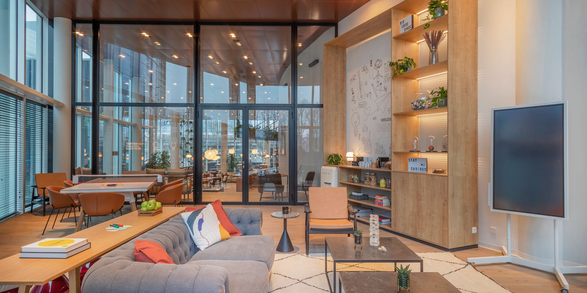 a room with a couch and tables