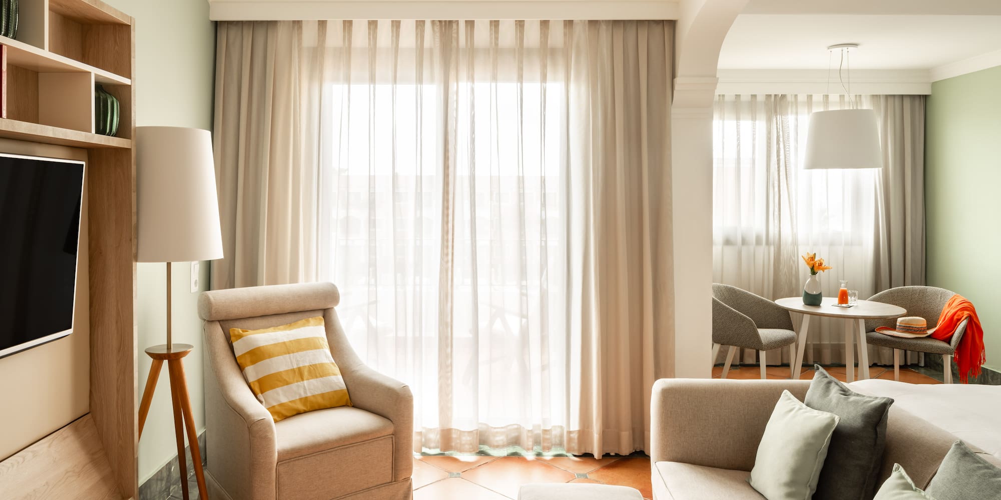 a living room with a couch and a chair