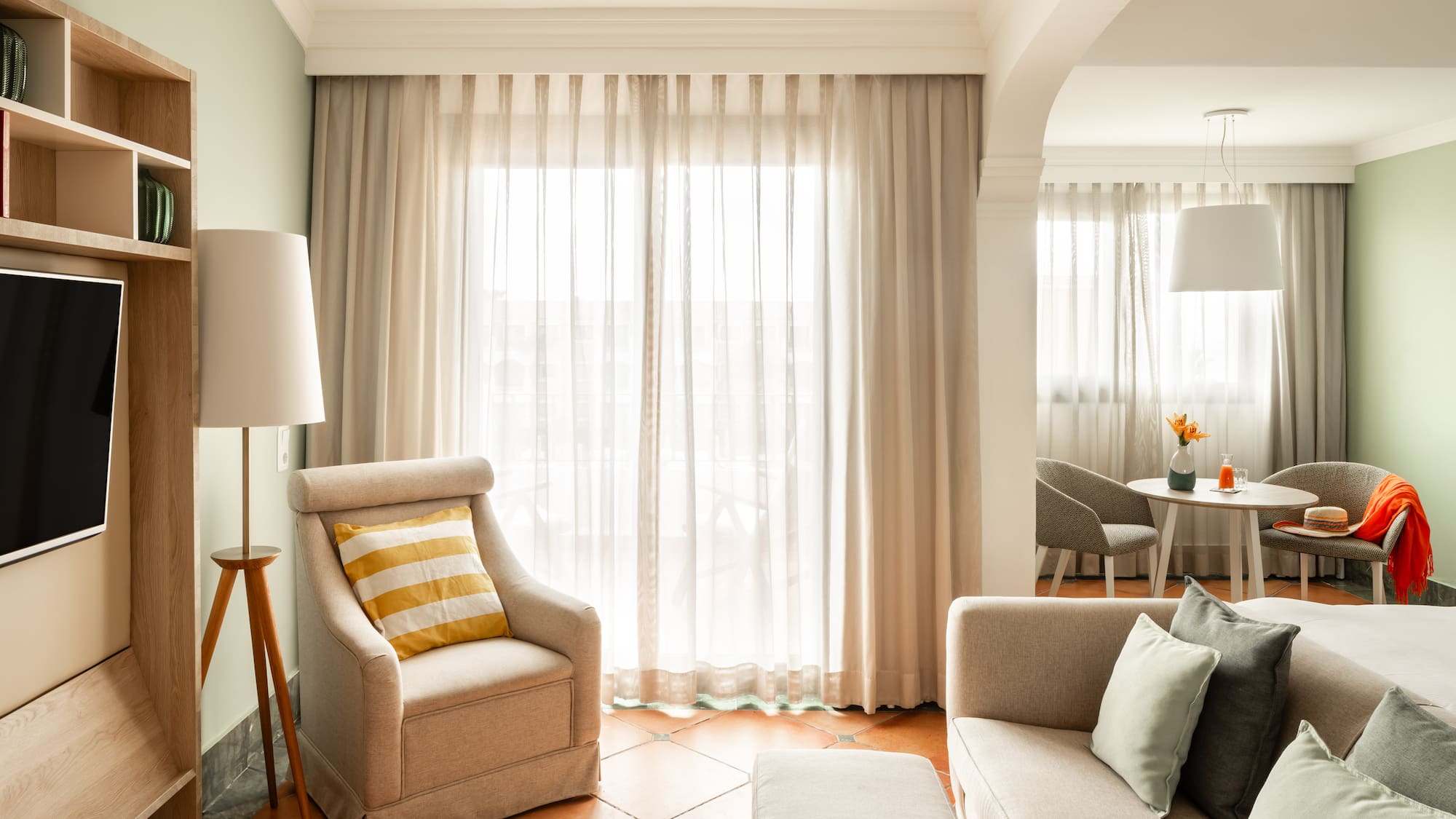 a living room with a couch and a chair