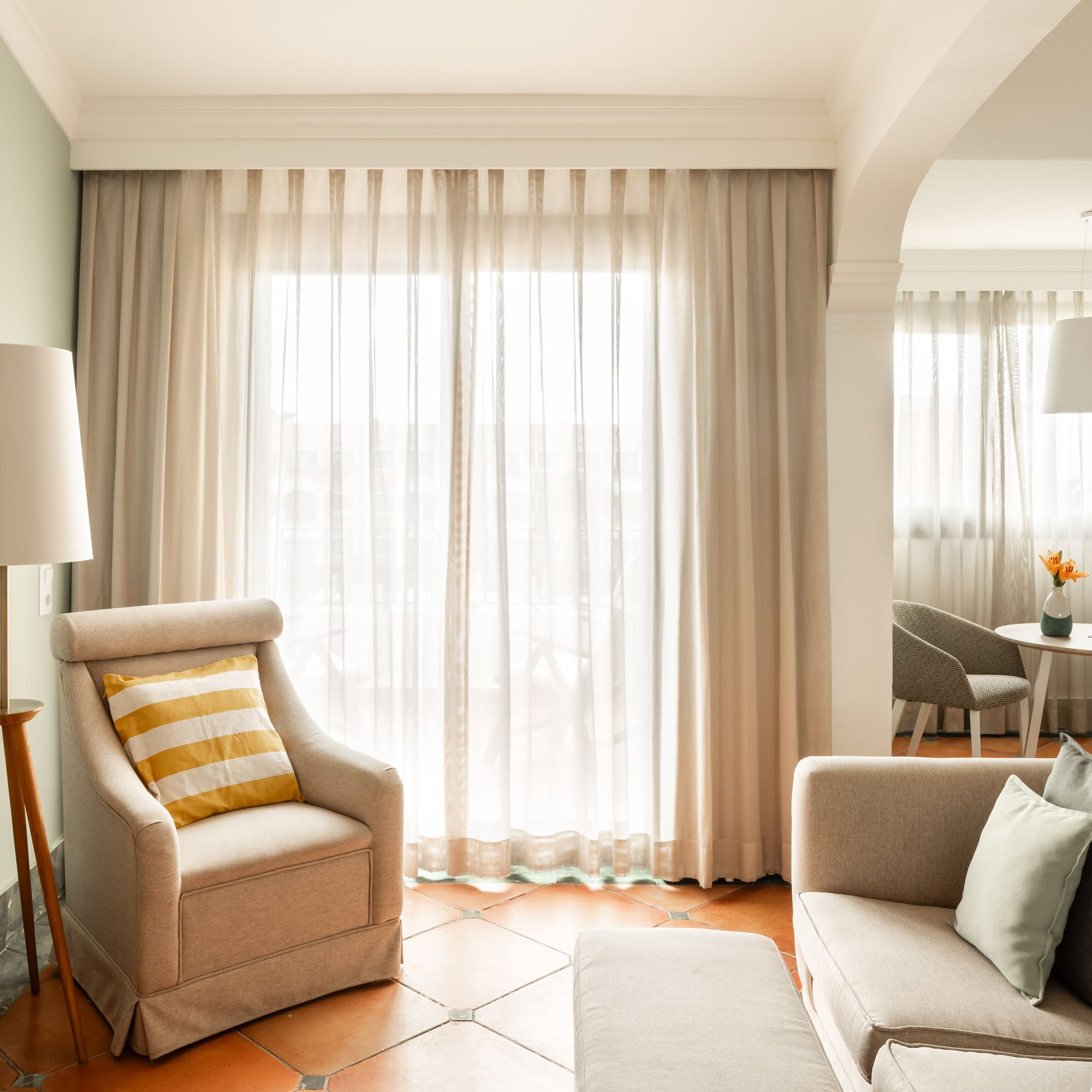 a living room with a couch and a chair