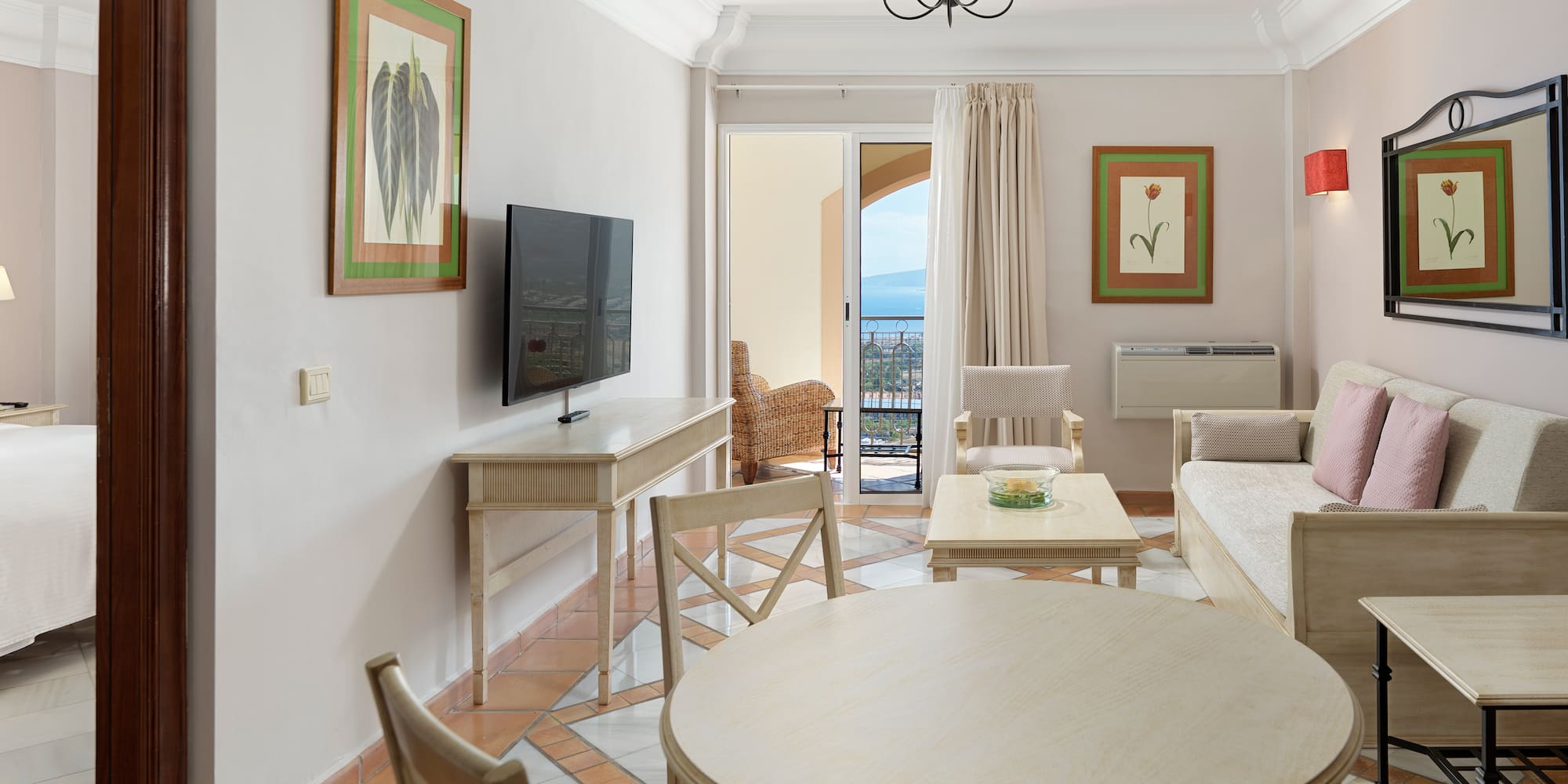 a living room with a television and a table