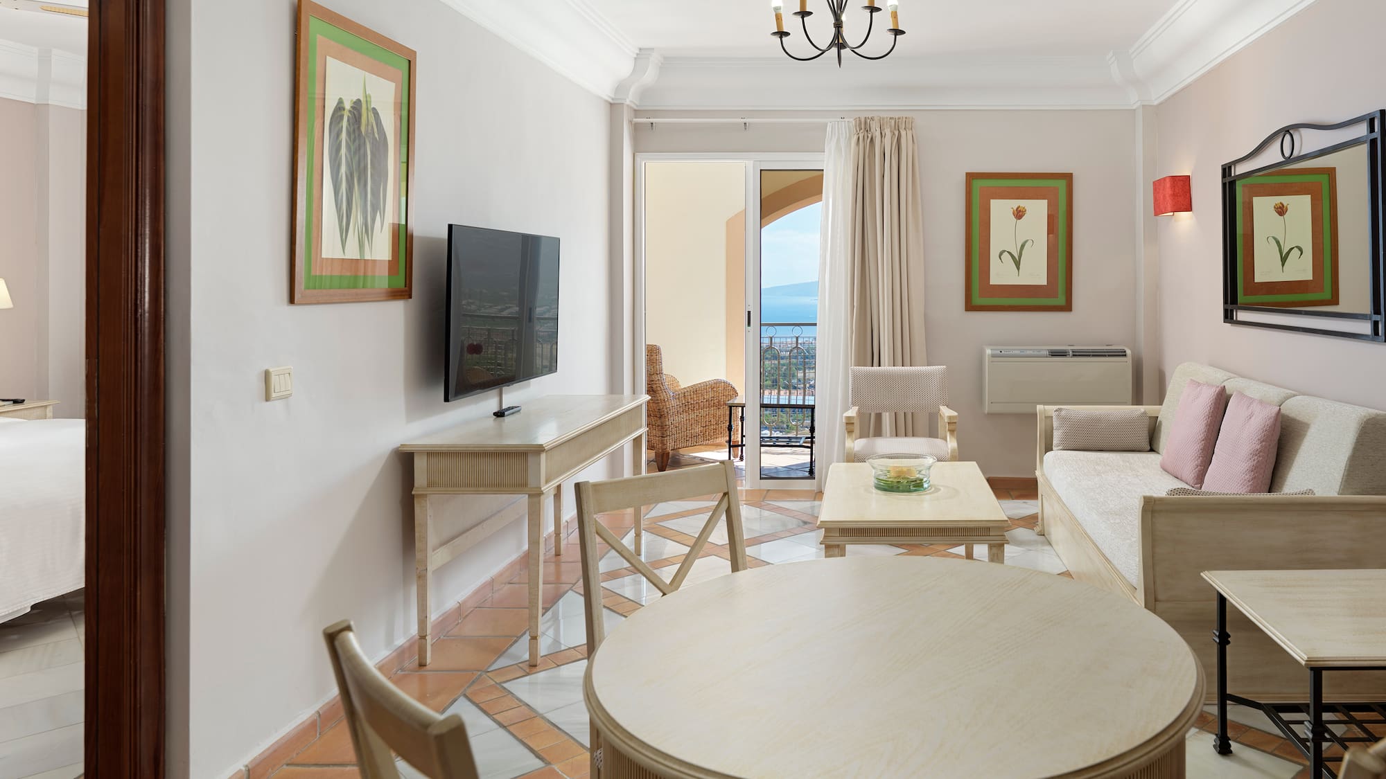 a living room with a television and a table