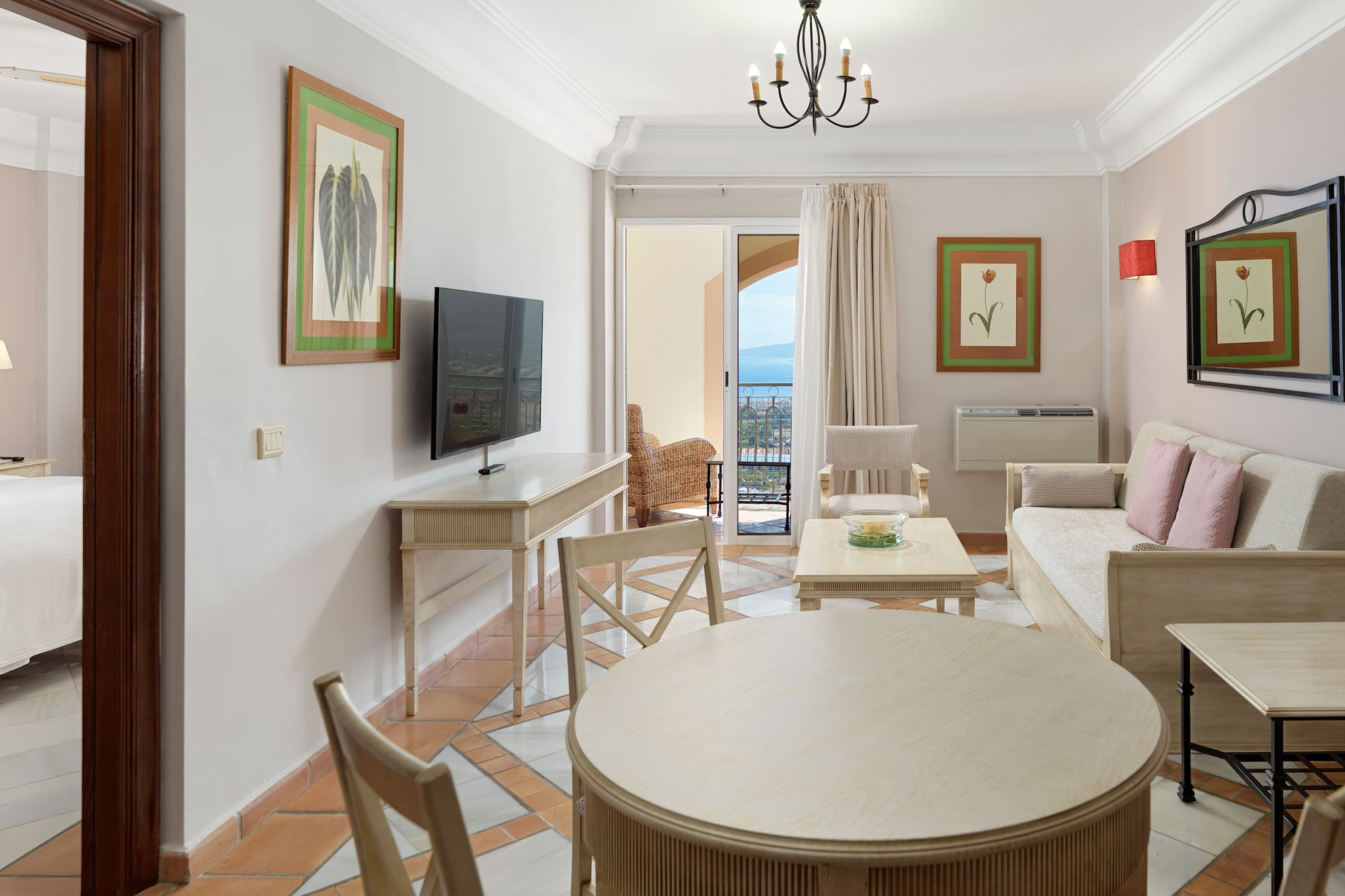a living room with a television and a table