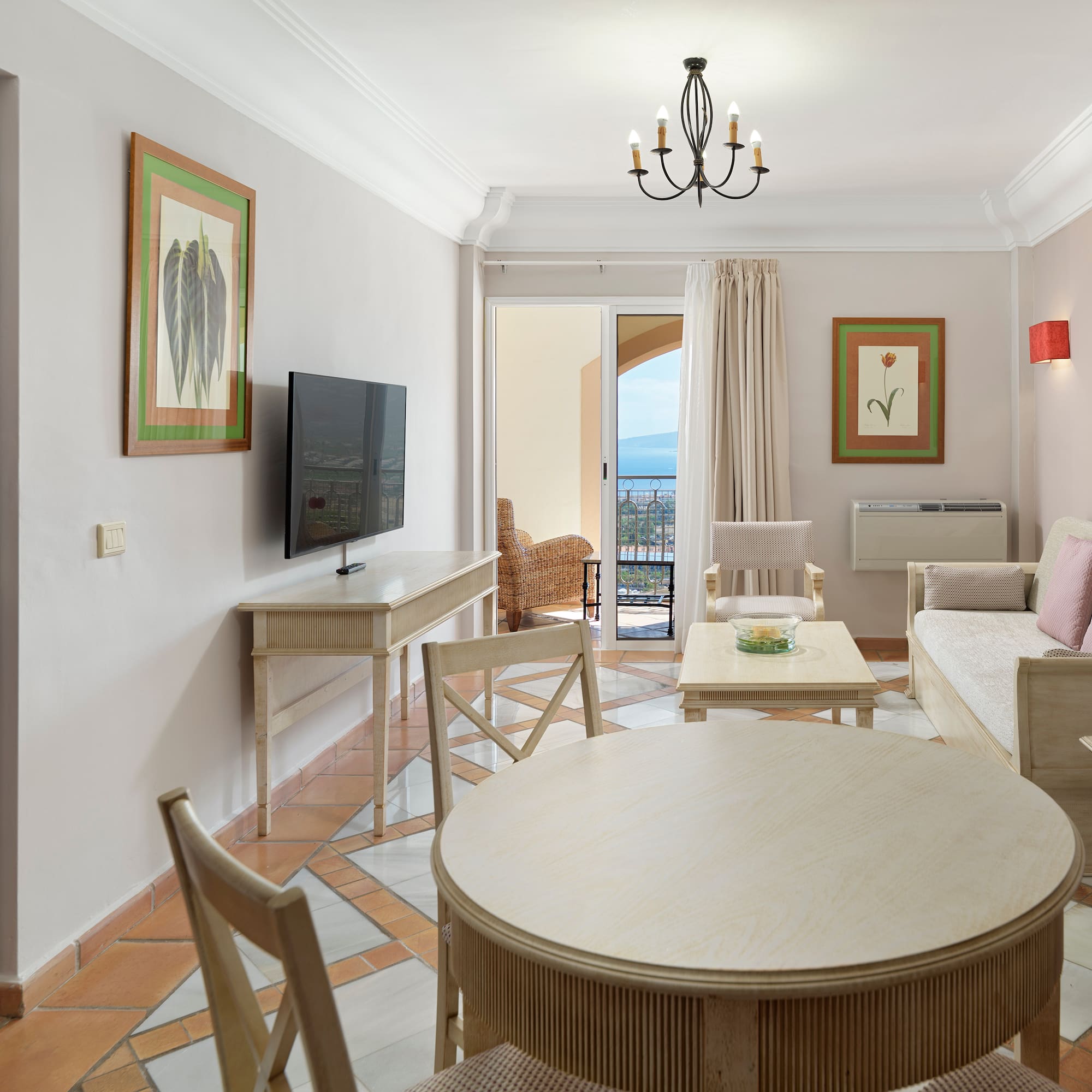 a living room with a television and a table