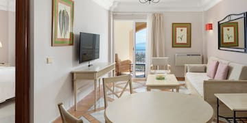 a living room with a television and a table