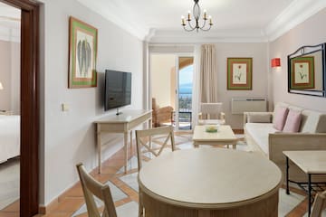 a living room with a television and a table