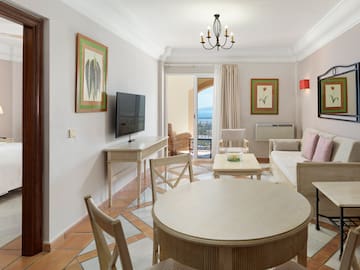 a living room with a television and a table