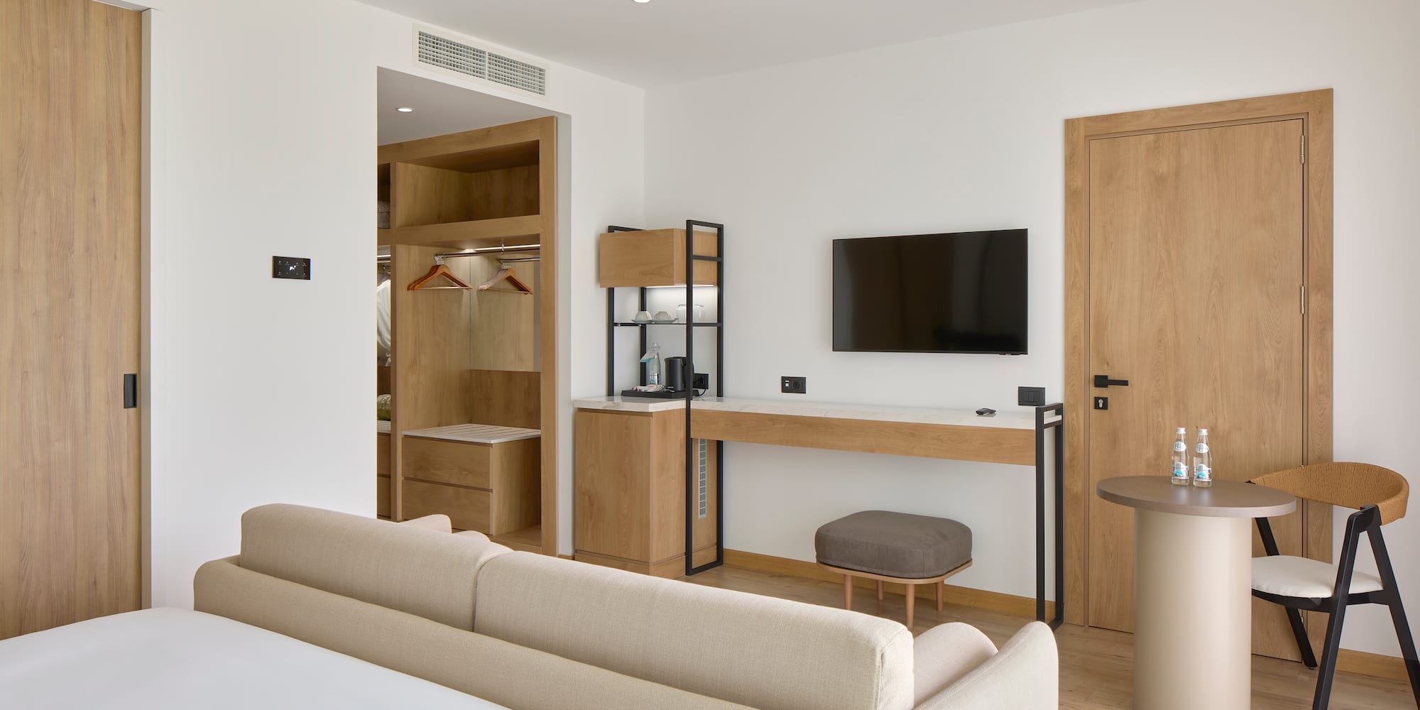 a room with a bed and a tv