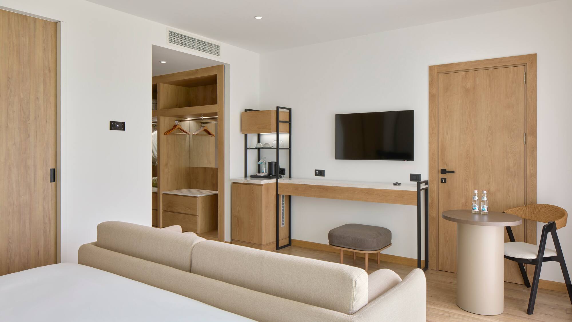 a room with a bed and a tv