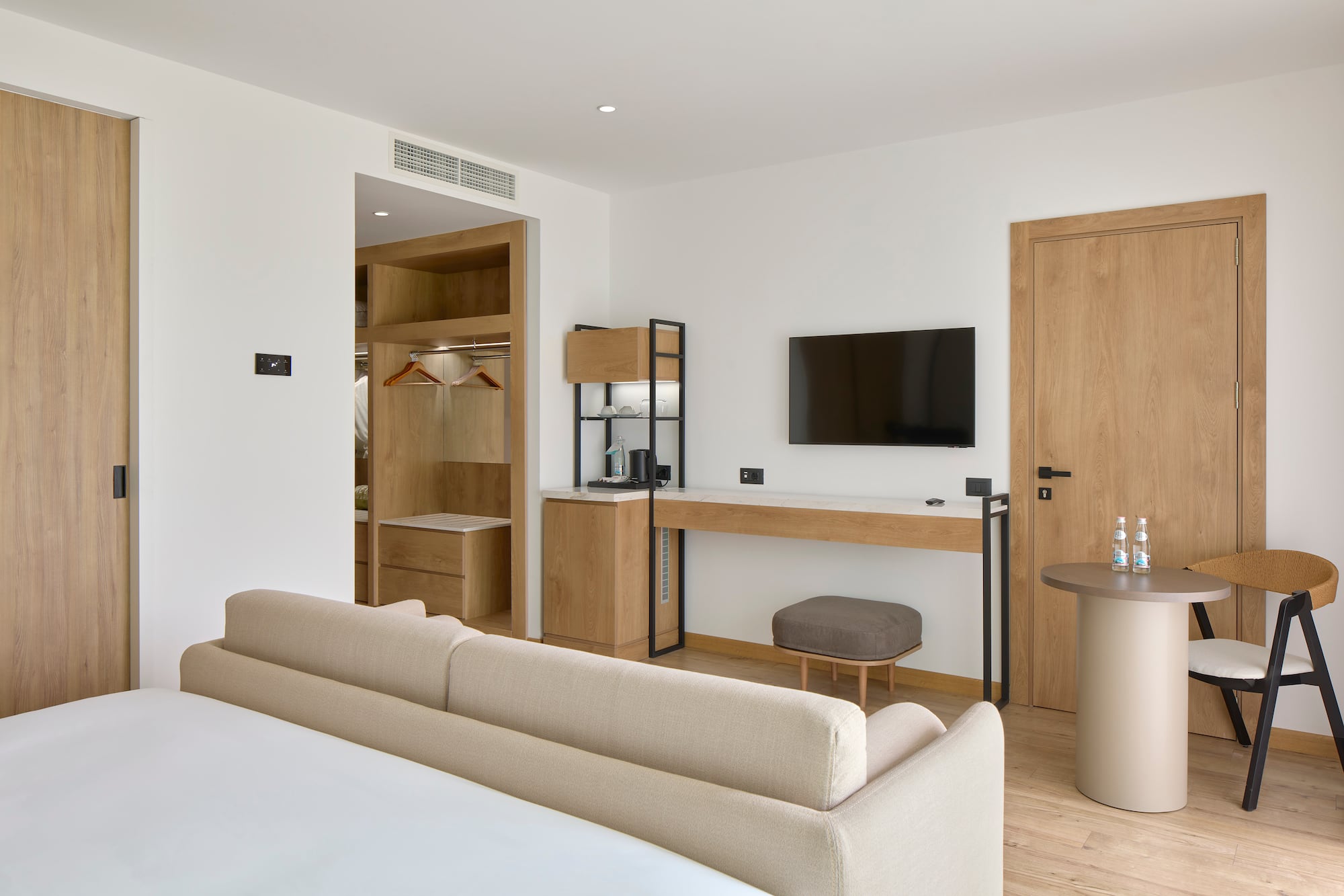 a room with a bed and a tv