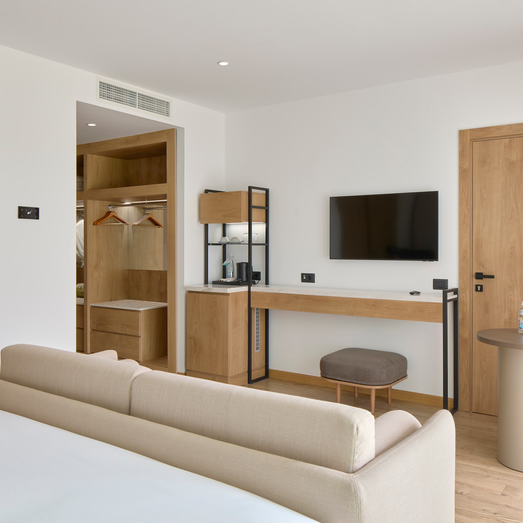 a room with a bed and a tv