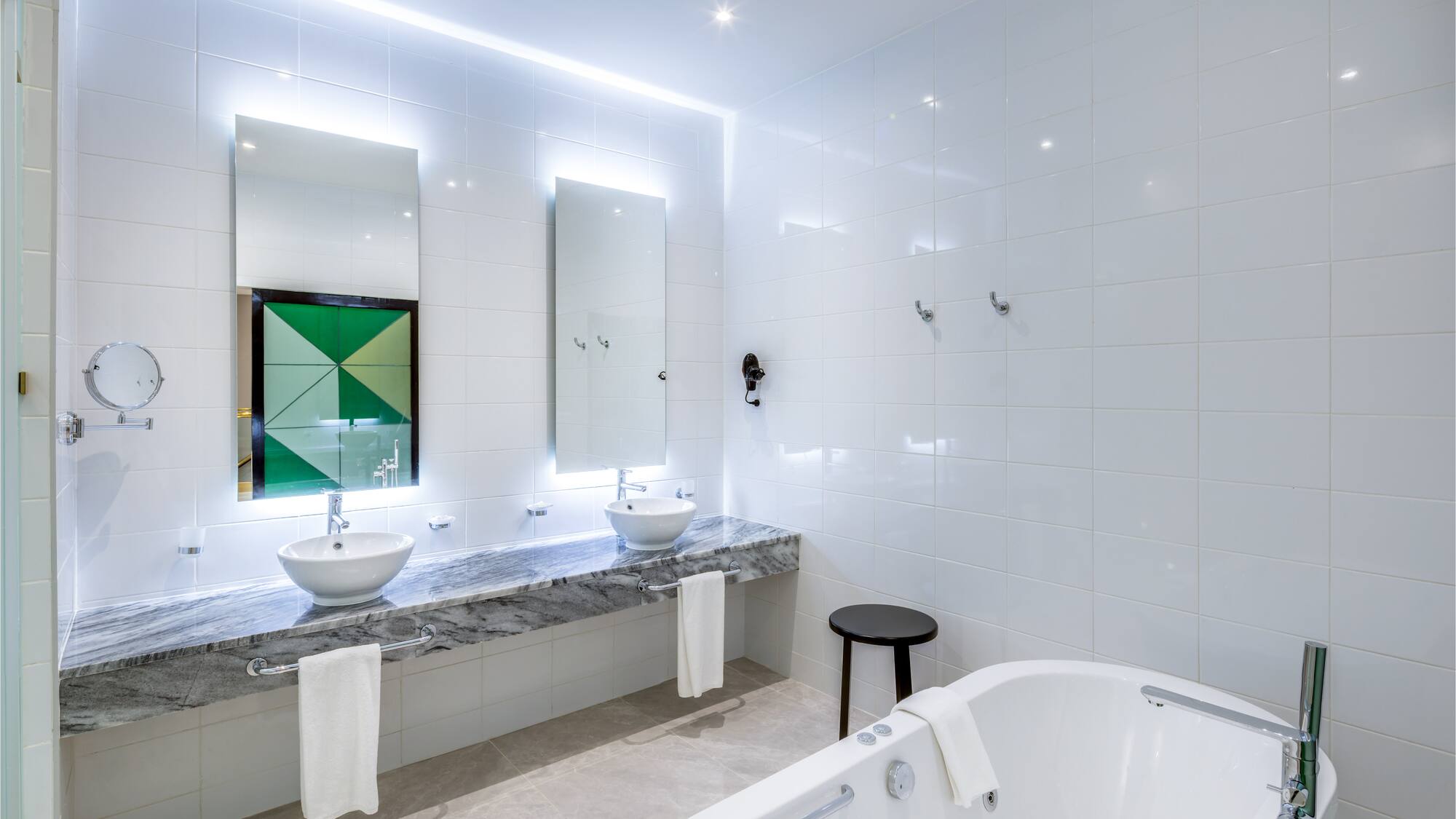 a bathroom with a tub and sink