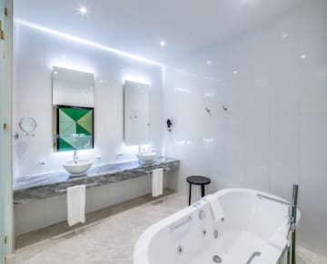 a bathroom with a tub and sink