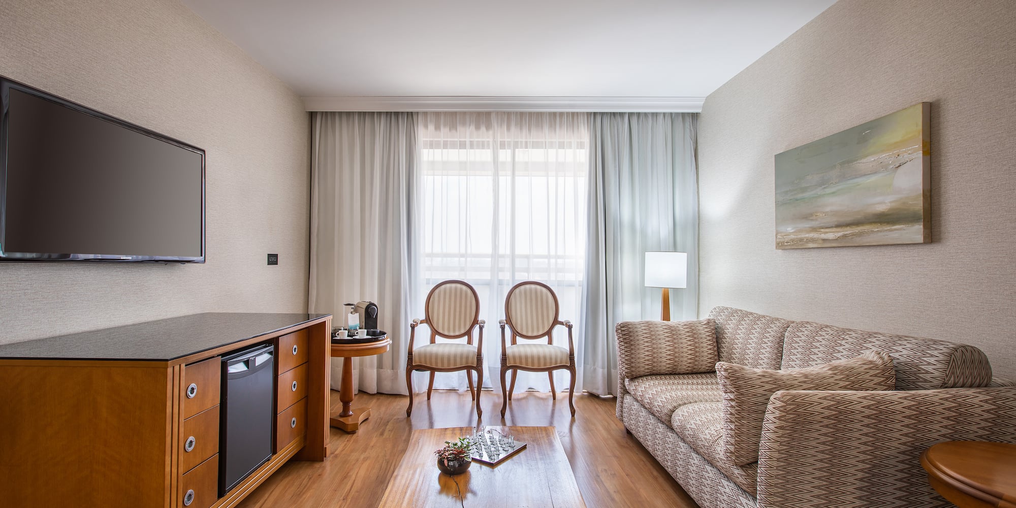 a living room with a couch and a tv