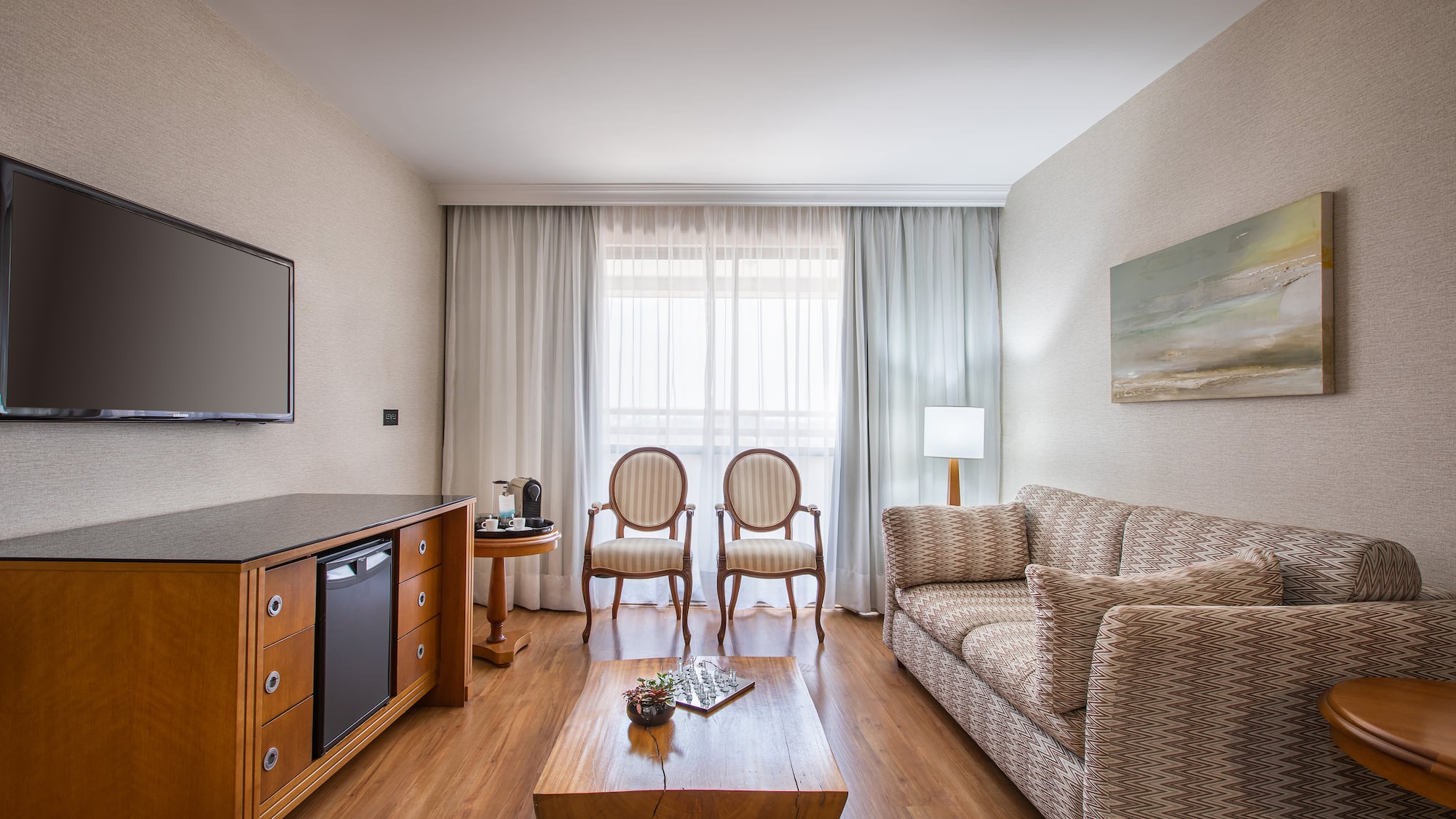 a living room with a couch and a tv