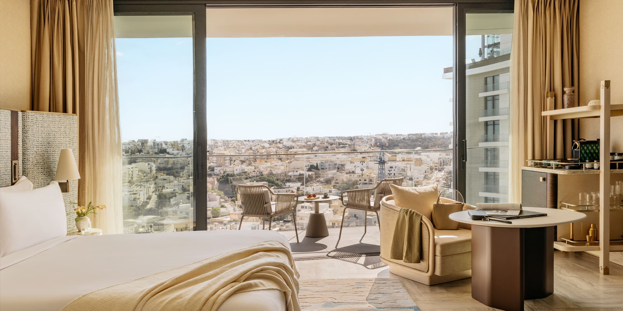 a room with a view of a city and a large window
