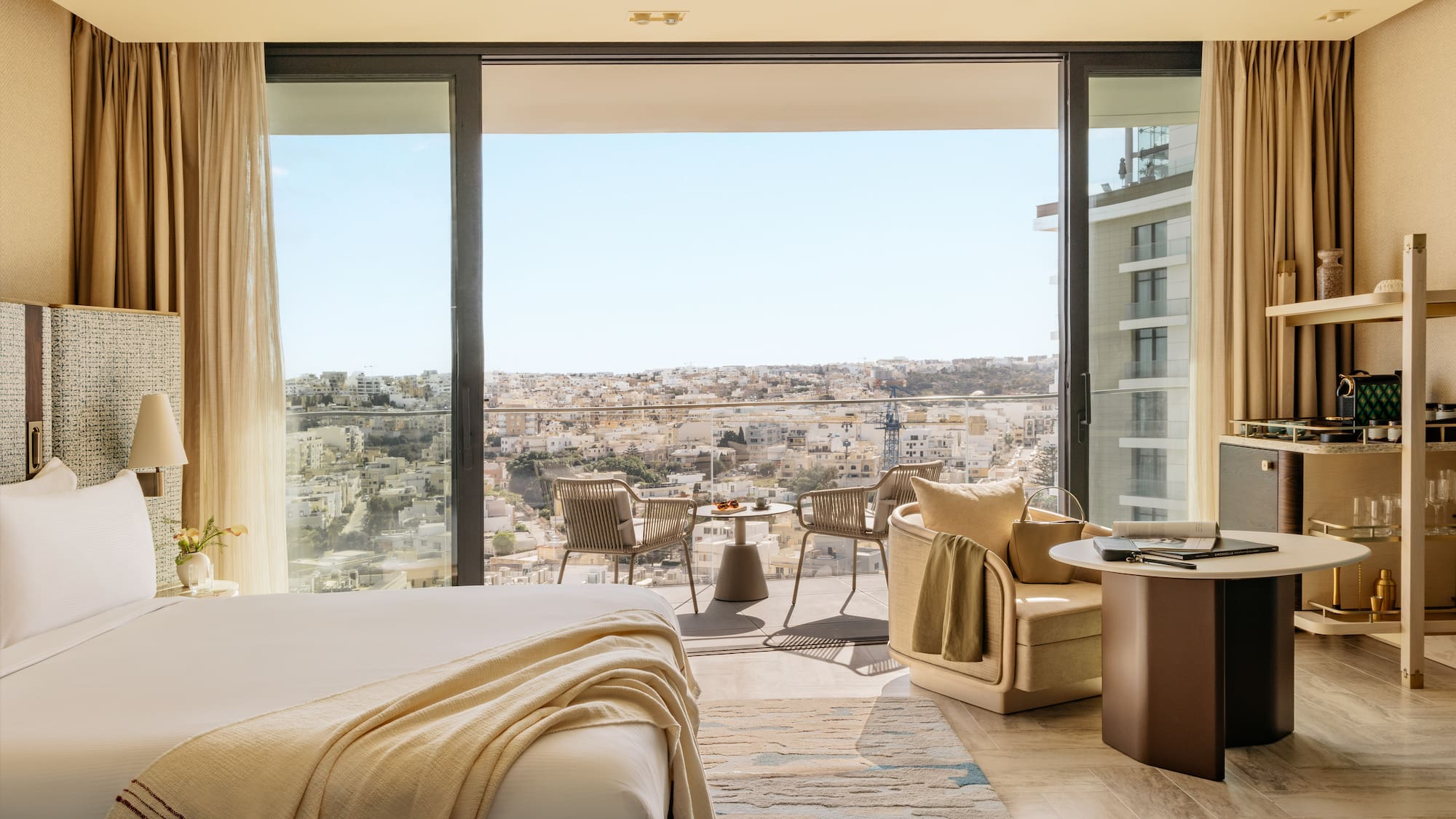 a room with a view of a city and a large window