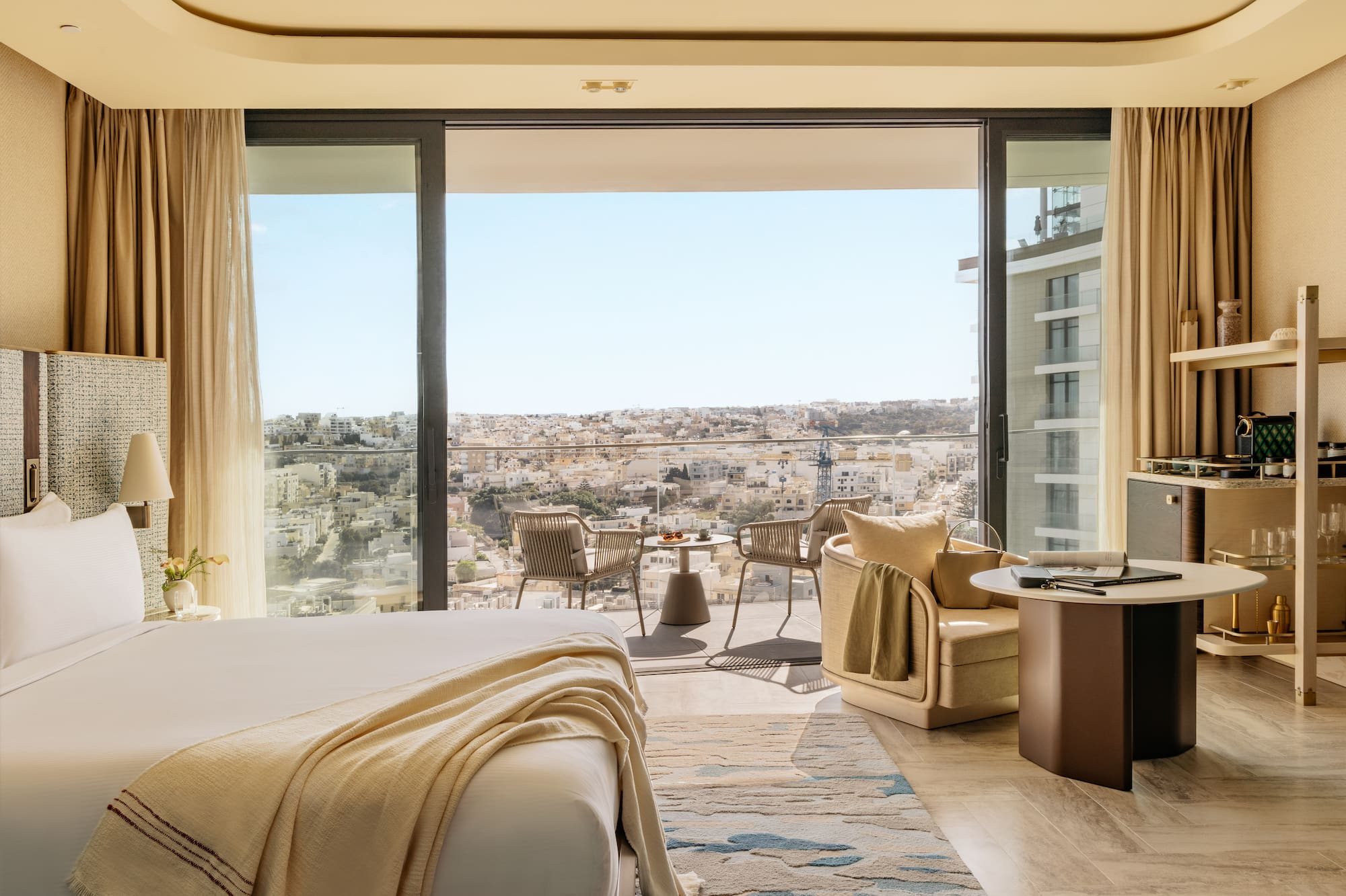 a room with a view of a city and a large window