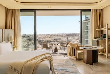 a room with a view of a city and a large window