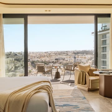 a room with a view of a city and a large window