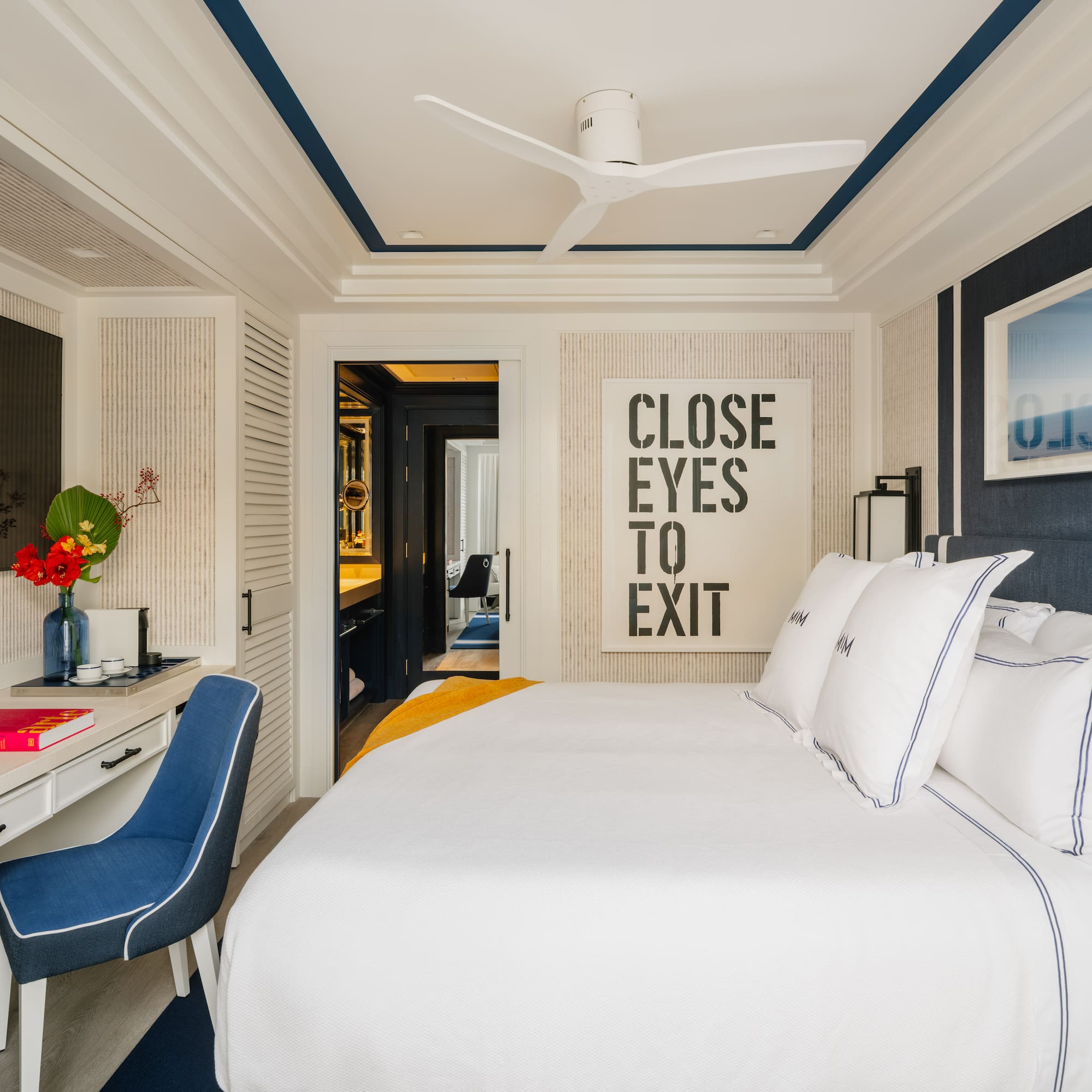 a bedroom with a bed and a desk