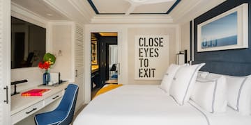 a bedroom with a bed and a desk