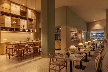 a restaurant with tables and chairs