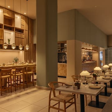 a restaurant with tables and chairs