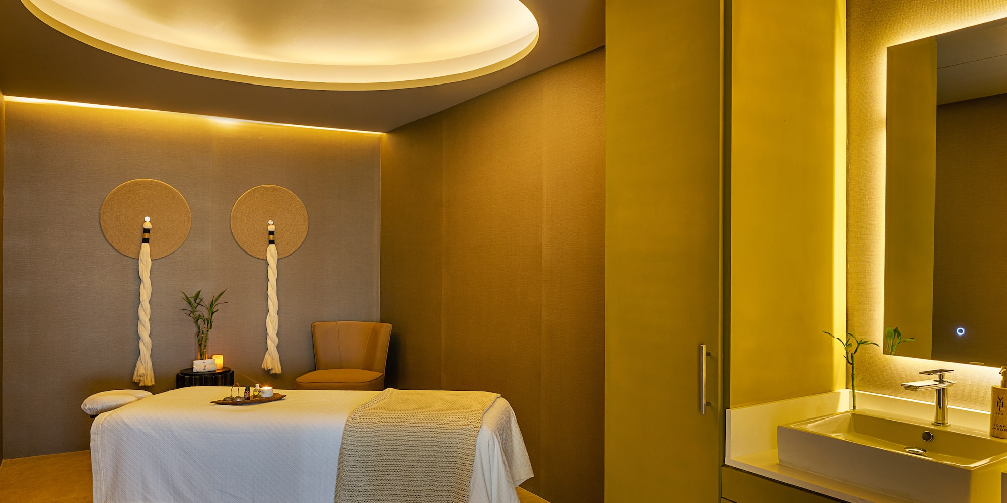 a room with a bed and a sink