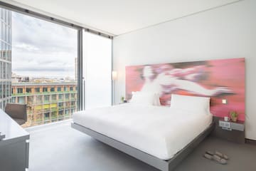 a bed with a large window