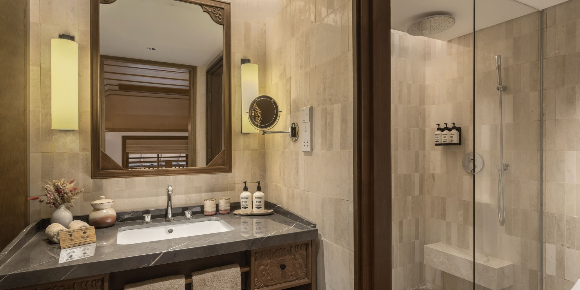 a bathroom with a mirror and a shower